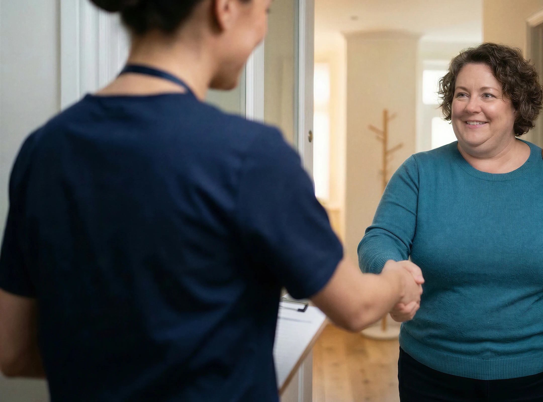 Woman greeting doctor